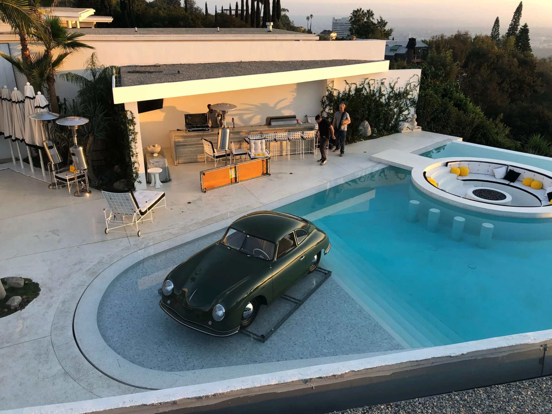 Pool Covers — Pool deck conversion with vintage car staging — hillside residence activation