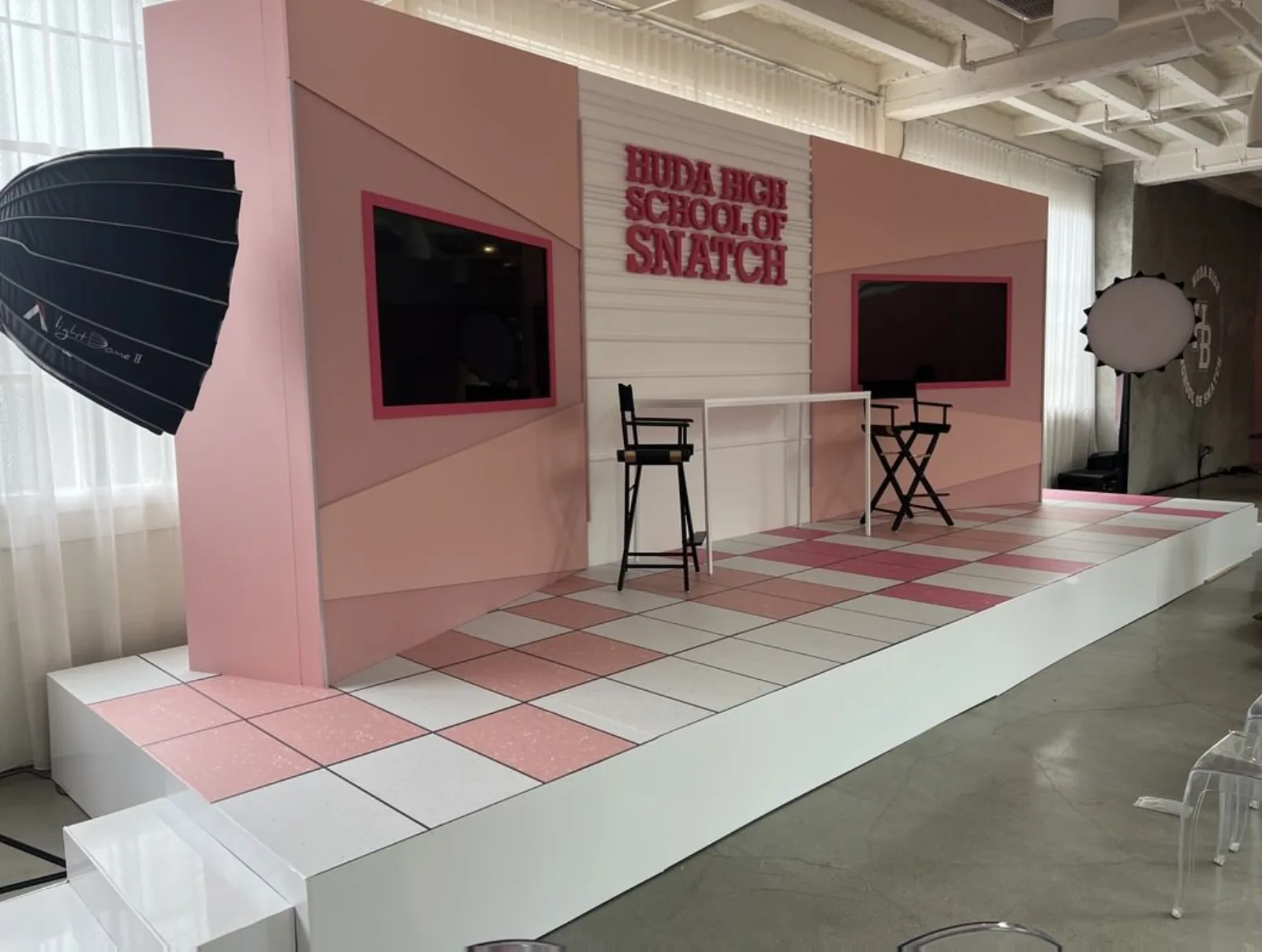 Customized Stages and Fabrication — Pink checkered runway with branded back wall — fashion creative production
