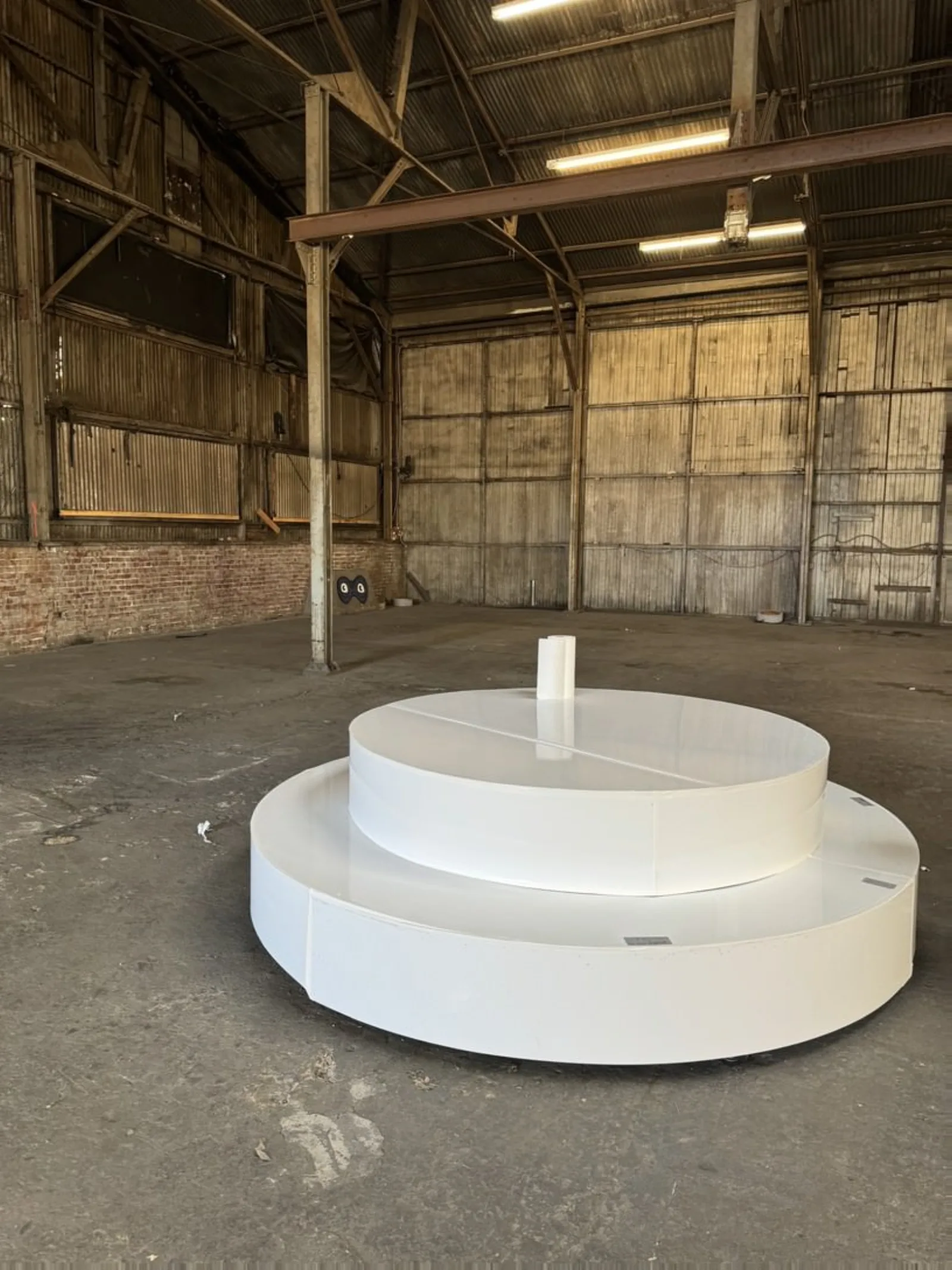 Circular and Round Stage Rental — Two-tier round white stage during build — pre-install in our LA production facility